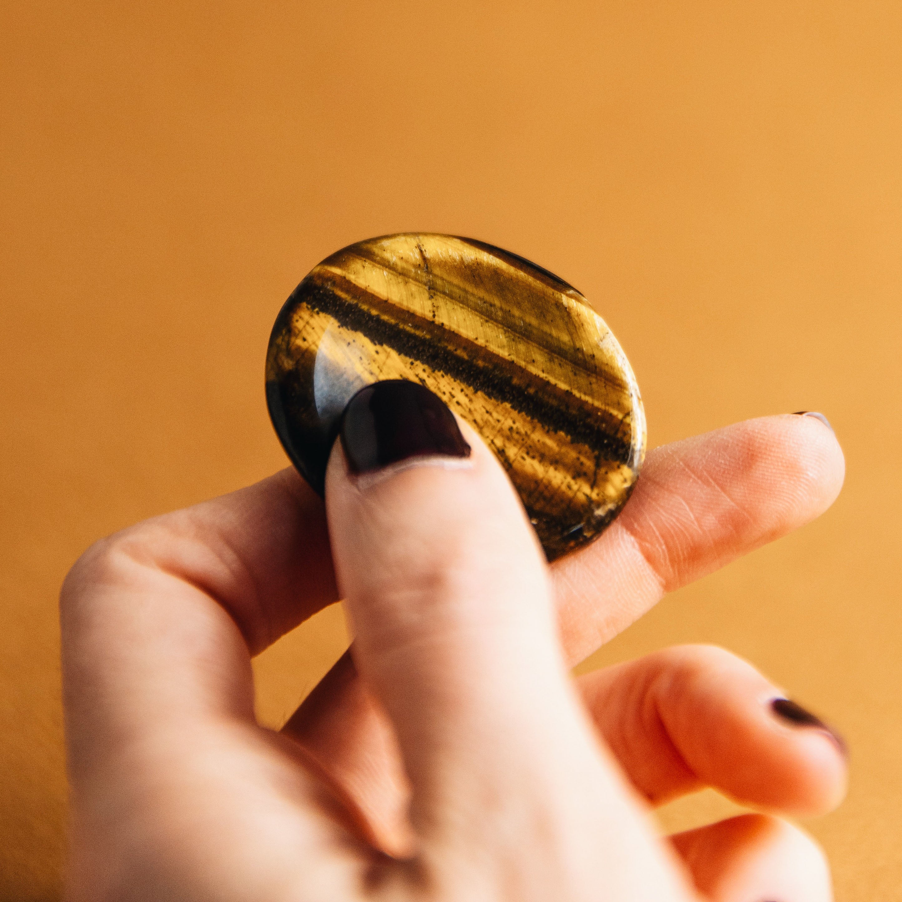 Shops 547 Palm stone or worry stone in this high grade tigereye is usually seen in jewelry. Tigereye helps ease tension adds to mental acuity.